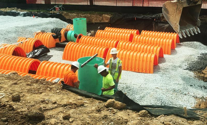 photo showing drainage system installation crew